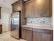 Kitchen with stainless steel refrigerator, attractive cabinets, and sleek countertops at 30073 Southwell Ln, Wesley Chapel, FL 33543