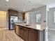 Open kitchen with stainless appliances, generous island and attractive cabinets at 30073 Southwell Ln, Wesley Chapel, FL 33543
