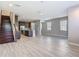 Open-concept living space with modern tile flooring and a staircase visible at 30073 Southwell Ln, Wesley Chapel, FL 33543