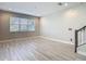 Bright living room featuring tile flooring and large windows at 30073 Southwell Ln, Wesley Chapel, FL 33543