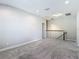 Open loft space featuring cozy carpet and modern recessed lighting at 30073 Southwell Ln, Wesley Chapel, FL 33543