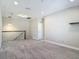 Spacious loft area with plush carpet, a staircase, and recessed lighting at 30073 Southwell Ln, Wesley Chapel, FL 33543