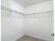 Walk-in closet with white walls and shelving at 30073 Southwell Ln, Wesley Chapel, FL 33543