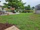 Spacious backyard with a pond view and patio seating area at 3110 57Th Avenue E Cir, Bradenton, FL 34203