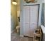 Bathroom features large closet, decorative mermaid, and blue and white accents at 3110 57Th Avenue E Cir, Bradenton, FL 34203