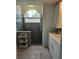 Upgraded bathroom featuring rainfall shower, modern fixtures, and ample counter space at 3110 57Th Avenue E Cir, Bradenton, FL 34203