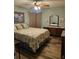 Charming bedroom with a queen-sized bed, coastal decor, and ample natural light at 3110 57Th Avenue E Cir, Bradenton, FL 34203
