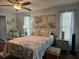 Bedroom offering a coastal design, with bright natural light from the windows at 3110 57Th Avenue E Cir, Bradenton, FL 34203