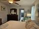 Bright bedroom with coastal themed decor leading to ensuite bathroom at 3110 57Th Avenue E Cir, Bradenton, FL 34203