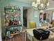 Bright dining room with bar area, chandelier, and views into the living room and kitchen at 3110 57Th Avenue E Cir, Bradenton, FL 34203