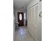 Inviting entryway features a decorative wood door with glass insert and tile flooring at 3110 57Th Avenue E Cir, Bradenton, FL 34203