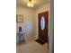 Inviting entryway features a decorative wood door with glass insert and tile flooring at 3110 57Th Avenue E Cir, Bradenton, FL 34203