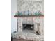 Close up on the stone fireplace, a cozy focal point of the living space at 3110 57Th Avenue E Cir, Bradenton, FL 34203