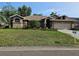 Charming one-story home with a well-manicured lawn and mature landscaping at 3110 57Th Avenue E Cir, Bradenton, FL 34203