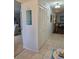 Hallway with closet and views of dining room with tile flooring at 3110 57Th Avenue E Cir, Bradenton, FL 34203
