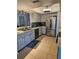 An updated kitchen featuring stainless steel appliances and ample counter space at 3110 57Th Avenue E Cir, Bradenton, FL 34203