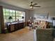 Bright living room featuring plush carpeting, a large window, and cozy furnishings at 3110 57Th Avenue E Cir, Bradenton, FL 34203