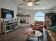 Inviting living room with a stone fireplace, vaulted ceiling, and comfortable seating at 3110 57Th Avenue E Cir, Bradenton, FL 34203