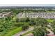 Neighborhood featuring trees, a pond, and well-spaced homes, creating a serene and inviting atmosphere at 3129 61St E Ter, Ellenton, FL 34222