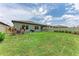 Spacious backyard features lush green lawn, complemented by a neutral fence, and garden landscaping at 3129 61St E Ter, Ellenton, FL 34222