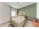 Cozy bedroom features neutral tones, a comfortable bed, and stylish decor, creating a serene and inviting atmosphere at 3129 61St E Ter, Ellenton, FL 34222
