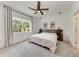 Inviting bedroom featuring a ceiling fan and large window with natural light at 3129 61St E Ter, Ellenton, FL 34222