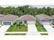 Well-manicured, single-story home with neutral colors, a two-car garage, and a walkway leading to the front door at 3129 61St E Ter, Ellenton, FL 34222