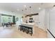 Spacious kitchen with bar seating and stainless steel appliances. Dining area in the background at 3129 61St E Ter, Ellenton, FL 34222