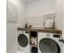 Well-organized laundry room with modern appliances and ample storage, making laundry day a breeze at 3129 61St E Ter, Ellenton, FL 34222