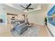 Open concept living area with a comfortable sofa, stylish decor, and a view of the modern kitchen, perfect for gatherings at 3129 61St E Ter, Ellenton, FL 34222