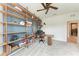 A view of the office with built in shelving and desk with a large window at 3129 61St E Ter, Ellenton, FL 34222