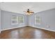 Spacious bedroom with wood-look floors, three windows and ceiling fan at 3320 19Th Street E Ct, Bradenton, FL 34208