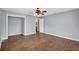 Bedroom with wood-look floors, ceiling fan, and walk in closet entrance at 3320 19Th Street E Ct, Bradenton, FL 34208