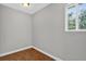 Bedroom with neutral walls, wood-look flooring, and a window at 3320 19Th Street E Ct, Bradenton, FL 34208