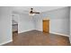 Upstairs bonus room with wood-look floors, vaulted ceilings, barn door and staircase at 3320 19Th Street E Ct, Bradenton, FL 34208