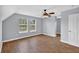 Upstairs bonus room features wood-look floors, ceiling fan, and bright windows at 3320 19Th Street E Ct, Bradenton, FL 34208