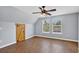 Upstairs bonus room with wood-look floors, vaulted ceilings, and a barn door at 3320 19Th Street E Ct, Bradenton, FL 34208