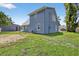 Well-maintained blue home featuring a spacious backyard, with a detached two-car garage at 3320 19Th Street E Ct, Bradenton, FL 34208