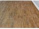 Close-up of the wood-look flooring with its natural wood-like texture and tile design at 3320 19Th Street E Ct, Bradenton, FL 34208