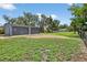 A spacious two car garage with a large grassy lawn and a fence around the property at 3320 19Th Street E Ct, Bradenton, FL 34208