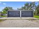 Two car garage with gray metal construction and concrete floor at 3320 19Th Street E Ct, Bradenton, FL 34208