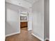 Hallway view of a bathroom showcasing a classic vanity with wood cabinets at 3320 19Th Street E Ct, Bradenton, FL 34208