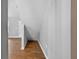 Hallway with stairs with wood-look tile flooring at 3320 19Th Street E Ct, Bradenton, FL 34208