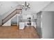 A bright kitchen featuring white cabinets, stainless steel appliances, and a wood grain tile floor at 3320 19Th Street E Ct, Bradenton, FL 34208