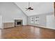 Open-concept living area with fireplace, lots of natural light, and wood-look tile flooring at 3320 19Th Street E Ct, Bradenton, FL 34208