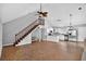 Bright and airy living area showcasing the open floor plan with the kitchen and staircase at 3320 19Th Street E Ct, Bradenton, FL 34208