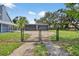 Fenced backyard with a spacious two-car garage, perfect for extra storage and hobbies at 3320 19Th Street E Ct, Bradenton, FL 34208