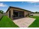 Well-maintained backyard featuring a brick patio and a screened-in porch at 3712 76Th E St, Palmetto, FL 34221