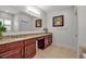 Bathroom features a double sink vanity with granite counters, and large mirror at 3712 76Th E St, Palmetto, FL 34221