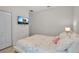 Bedroom with white walls, wood floors and a television on the wall at 3712 76Th E St, Palmetto, FL 34221